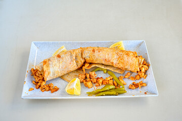 Meat, chicken shawarma kebab with yogurt and fried butter sauce .Tantuni Special. durum  Yogurtlu tantuni. Ekmek arasi tantuni. 