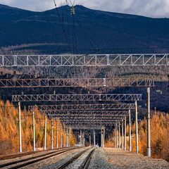 Transportation industry. Railway tracks against a beautiful sunset and mountains