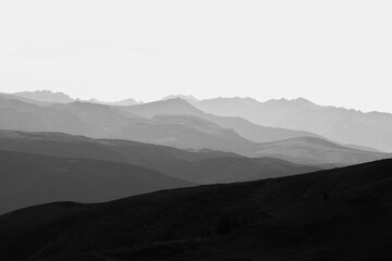 grayscale image of a scenic mountain landscape in different brightness