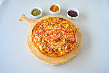 Traditional Turkish cuisine. Pizza, pita, pidesi, sucuk, hummus, kebab. Many dishes on the table. Serving dishes in restaurant. Margherita,  mix, formaggi, veggie karisik pizza. Top view, flat lay
