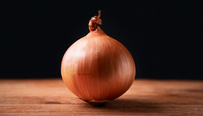 close up of onion on desk in opposition to black background