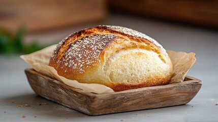 Naklejka premium Crusty sourdough bread in wooden bowl, kitchen background, food photography, recipe illustration