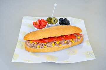 Close-up shot of Izmir's famous Turkish Traditional Kumru Sandwich, Ceşme Kumru, patso ingredients ready to eat salami, soudjouk, tomato, cheddar cheese and fried cheese. Yengen sandvic.