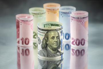 100 american dollars standing in front of Turkish money.
Reflection and macro shot