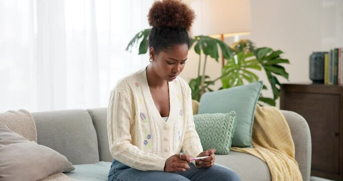 Worried, woman and anxiety with pregnancy test on sofa for concern, stress or mistake at home. Anxious, female person or expecting mother with unplanned maternity or positive results for abortion