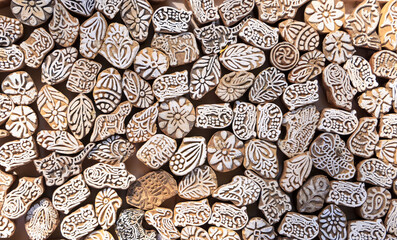 Many carved wood blocks with designs for saree printing commonly used in Rajasthan, India