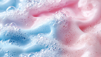Fototapeta premium Close-up of gentle bath foam with soft pink and blue hues creating a relaxing spa atmosphere