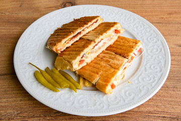 Turkish karisik atom Ayvalik tost ( kasarli bazlama tost) . Sucuklu, Kasarli, kavurmali karisik tost. Flat baked bread toasted. Karisik bazlama tost .  