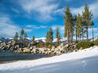 Beach at Sand Harbor State Park on Lake Tahoe, Nevada covered in snow.