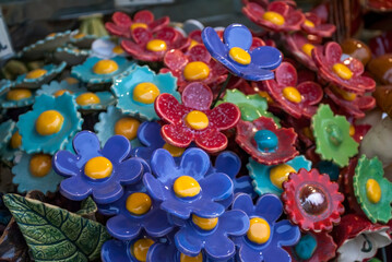 Bouquet of decorative flowers. Multicolored ceramic daisies