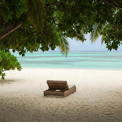 Stunning tropical beach with impressive turquoise waters and lush greenery.There is a lounge chair in the sand. Magnificent destination for a peaceful, engaging and delightful holidays. 