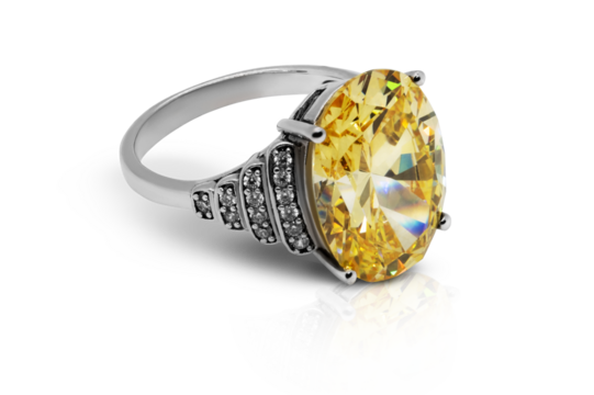A closeup of a sophisticated women's ring featuring a large, brilliant yellow stone, accented with small diamonds on the silver band on a transparent background