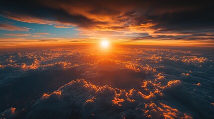A breathtaking sunset above the clouds, showcasing vibrant colors and tranquility.
