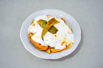 Delicious yogurt scene with Casserole bowl. Closeup shot of healthy fresh yogurt. Karisik kizartma. Top view.