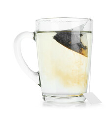Tea bag in glass cup with hot drink isolated on white