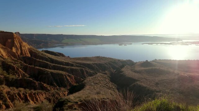 Panoramic view of the Castrejon reservoir next to the mountains of Toledo, Castilla la Mancha, Spain.