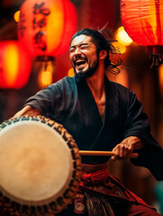 Traditional Japanese taiko drummer mid-strike in outdoor festival setting with red lanterns