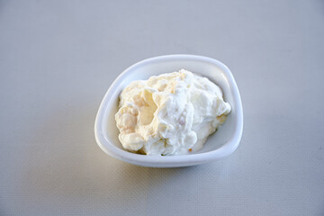 Delicious yogurt scene with Casserole bowl. Closeup shot of healthy fresh yogurt. Karisik kizartma. Top view.