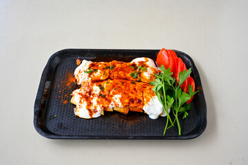 Meat, chicken shawarma kebab with yogurt and fried butter sauce .Tantuni Special. Yogurtlu tantuni.