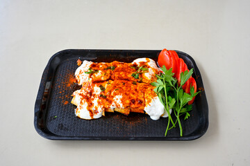 Meat, chicken shawarma kebab with yogurt and fried butter sauce .Tantuni Special. Yogurtlu tantuni.