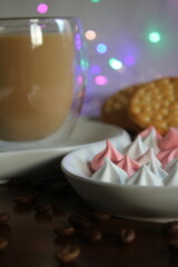 a cup of coffee and cookies