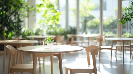 Obraz premium Serene Cafe Interior: Sunlight Drenched Tables and Lush Greenery