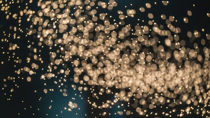 An artistic display of shimmering golden bokeh lights creating a magical and dreamy atmosphere.