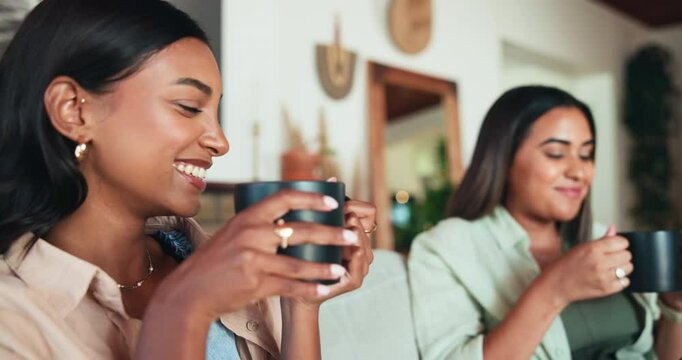 Women, friends and drinking coffee on sofa, relax and happy with funny memory for bonding in house. People, smile and laughing with mug, story and gossip with secret in living room at apartment