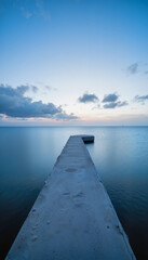 Fototapeta premium Tranquil seascape at dusk with empty path to horizon, reflective serenity
