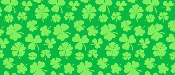 Seamless pattern with green clover leaves on a green background. Festive background for St. Patrick's Day.