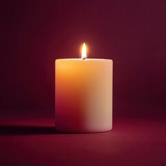 Soft glow of a burning candle creates a serene atmosphere against a dark backdrop