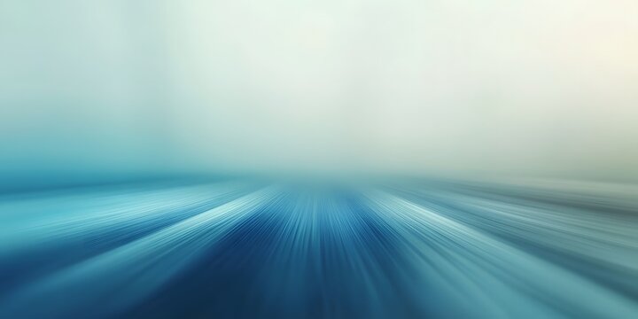 Blurred Motion: Abstract Speed and Movement: An abstract image depicting a dynamic sense of speed and movement, with streaks of blue and white converging towards a central vanishing point.