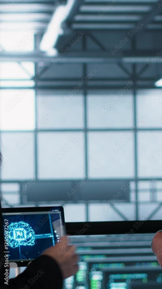 Poster vertical video team of engineers in data center with tablet integrating ai driven automation tools, 