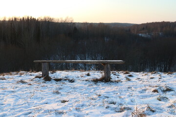 Wooden bench in winter
