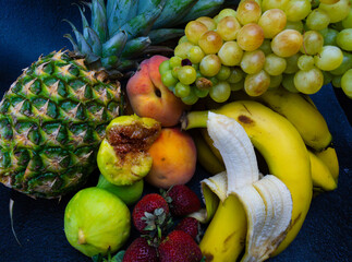 Delicious fruits with wonderful colors, taken under artificial light