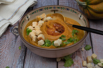 Vegan cream soup made with roasted pumpkin, carrot and tomato, topped with croutons.