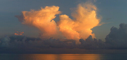 Beautifully illuminated clouds of Caribbean sunrise