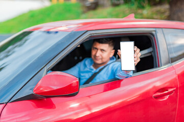 Happy driver showing cell phone screen. Driver showing blank cell phone screen outdoors