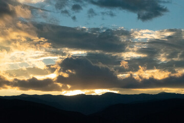 Glowing Clouds at Sunset Over Rocky Mountains