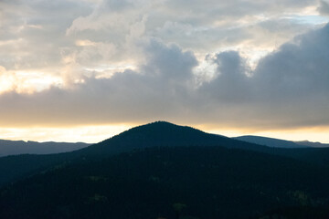 Glowing Clouds at Sunset Over Rocky Mountains