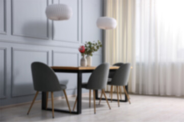 Blurred view of stylish dining room interior