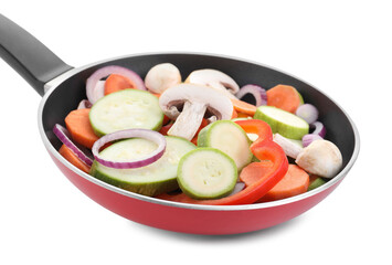 Frying pan with mix of fresh vegetables and mushrooms isolated on white