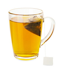 Tea bag in glass cup with hot drink isolated on white