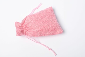 One pink burlap sack on white background, top view