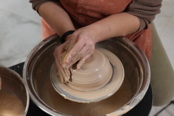 Hobby and craft. Woman making pottery indoors, closeup
