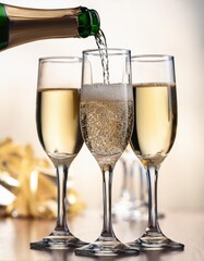 Pouring Sparkling Champagne into Crystal Glasses with Bubbles Rising