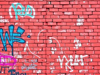 Graffiti Symphony: A Canvas of Raw Expression on Brick