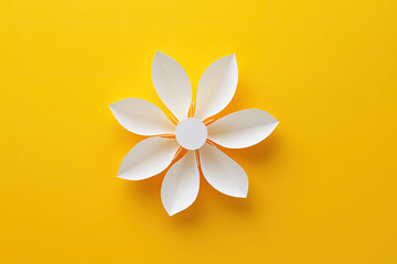 Fototapeta premium Minimalist White Paper Flower on Bright Yellow Background