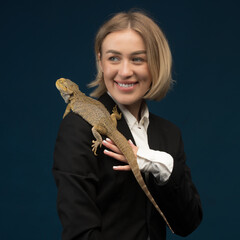 Portrait of a businesswoman with a lizard