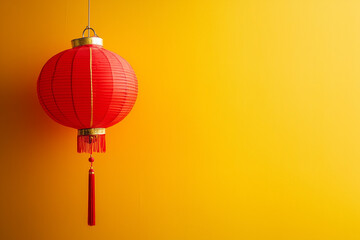 Fototapeta premium Red Chinese lantern isolated on a yellow background